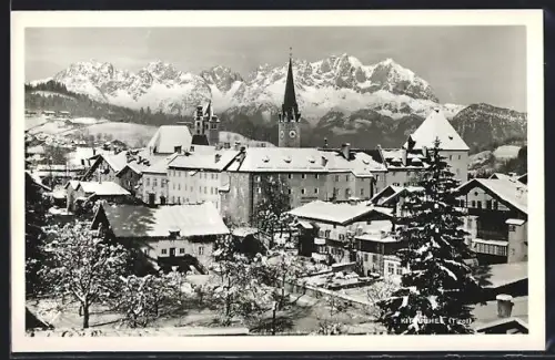 AK Kitzbühel /Tirol, Ortspartie mit Kirche im Schnee