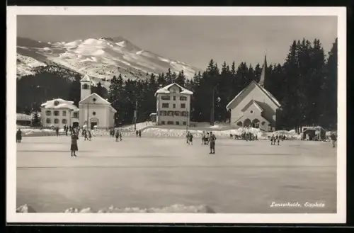 AK Lenzerheide, Eisplatz mit Kirche im Winter