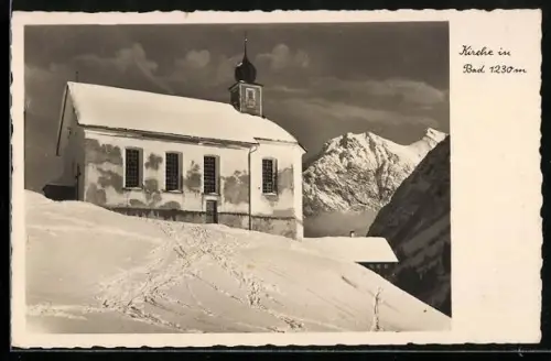 AK Bad, Kirche und gewaltiges Bergpanorama im Winter