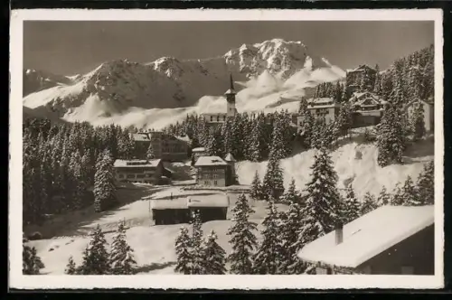 AK Arosa, Vom Schnee bedeckte Ortschaft mit Kirche