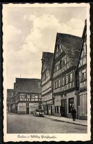 AK Aalen /Wttbg., Hirschgasse mit Geschäftshaus, Fachwerk, Strassenpartie