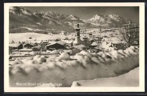 AK Reit im Winkl, Winteransicht mit Kirche und Kaisergebirge