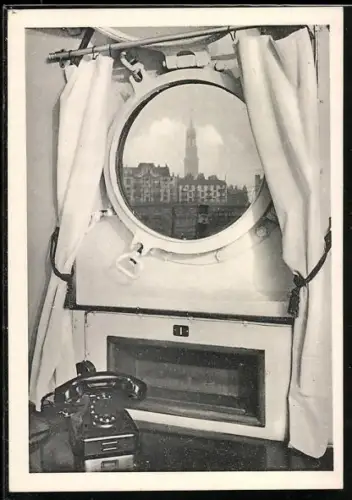 AK Hamburg, Blick durch das Bullauge vom Hotelschiff Daressalam auf die Michaeliskirche