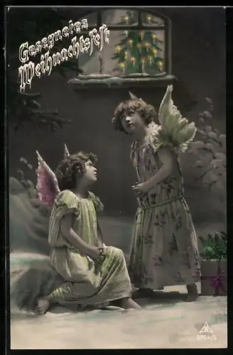 AK Zwei Weihnachtsengel in einer verschneiten Stadt