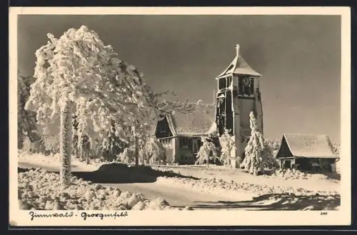 AK Zinnwald-Georgenfeld, Ortspartie mit Kirche im Winter