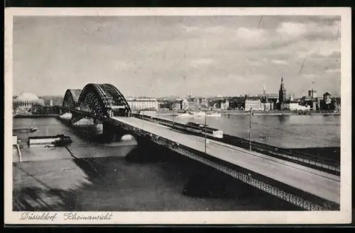 AK Düsseldorf, Rheinansicht, Rheinbrücke mit Strassenbahn