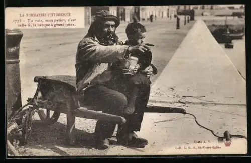 AK Fischer mit einem Jungen auf dem Schoss