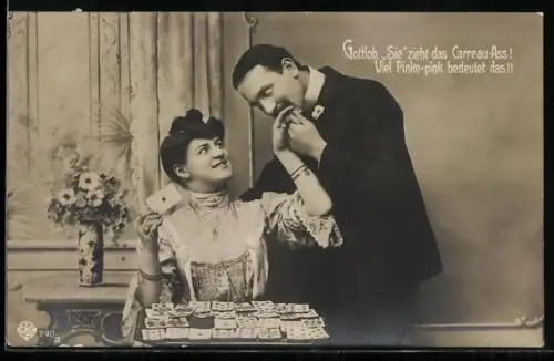 AK Dame beim Kartenlegen mit Ass, Mann küsst ihre Hand