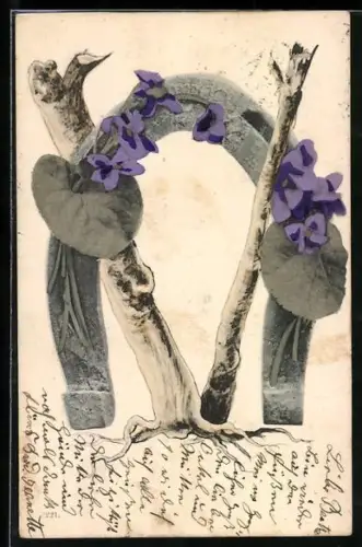 AK Baumstämme formen den Buchstaben V, dazwischen ein grosses Hufeisen