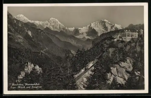 AK Interlaken, Bergbahn mit Blick auf Heimwehfluh, Eiger und Mönch