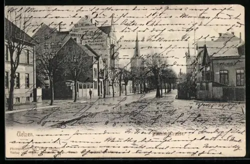 AK Uelzen, Partie in der Bahnhofstrasse mit Kirchturm