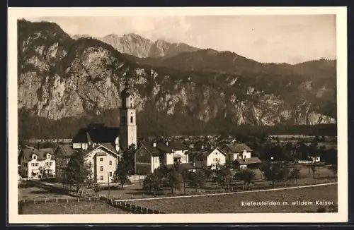 AK Kiefersfelden, Ortsansicht mit Kirche und wildem Kaiser