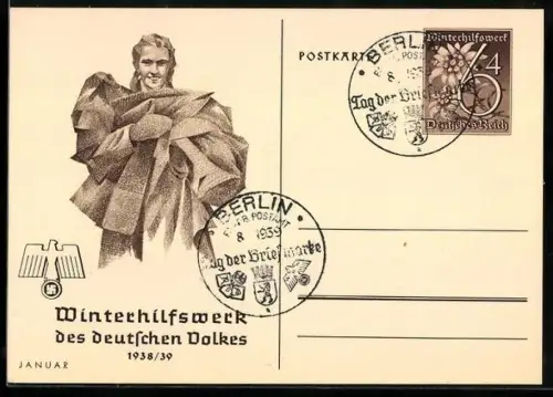 AK Frau trägt Dekcen, Ganzsache WHW Winterhilfswerk
