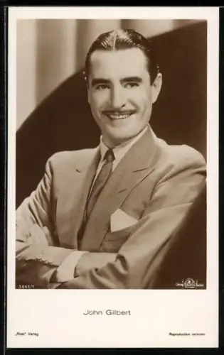 AK Schauspieler John Gilbert lächelnd im Anzug posierend