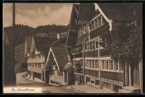 AK Schwellbrunn, Strassenpartie mit Holzhaus