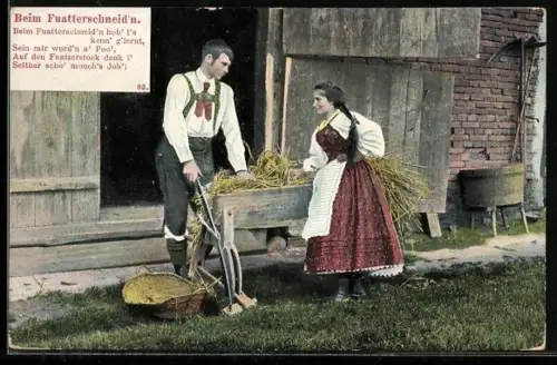 AK Bauernpaar schneidet Futter für das Vieh