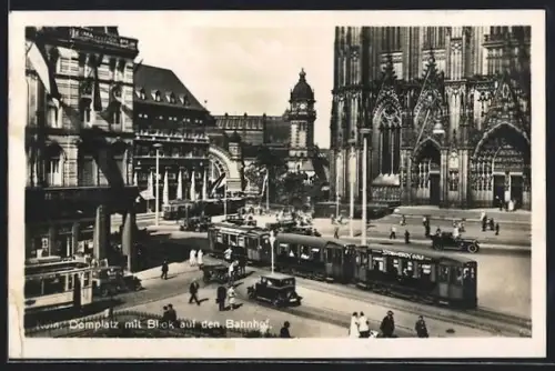 AK Köln, Domplatz mit Bahnhof und Strassenbahnen
