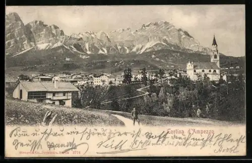 AK Cortina d`Ampezzo, Ortsansicht mit der Kirche vom Weg aus