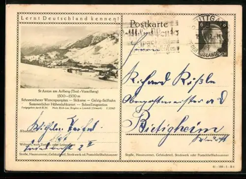 AK St. Anton am Arlberg, Schneebedeckter Ort mit Gebirgspanorama, Ganzsache
