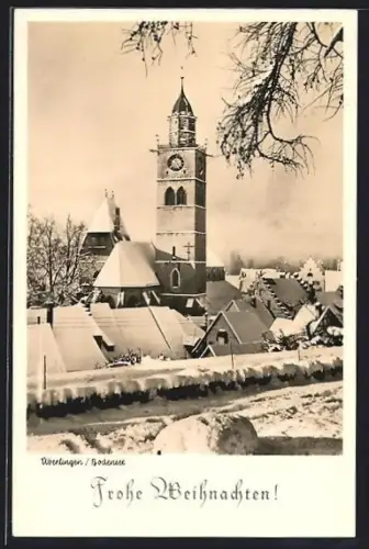 AK Überlingen /Bodensee, Verschneite Stadtansicht mit Kirche und Uhrturm