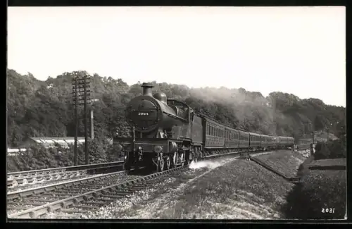 AK Britische Lokomotive Nr. 1064 mit acht Personenwaggons, englische Eisenbahn