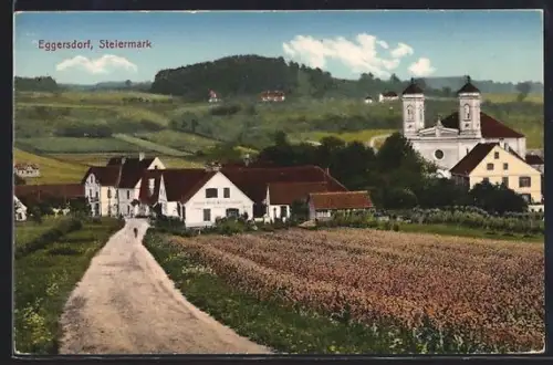 AK Eggersdorf /Steiermark, Feldweg mit Kleidergeschäft Franz Hödl und Kirche
