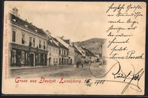 AK Deutsch-Landsberg, Strassenpartie mit Geschäft Nicolaus Krieger