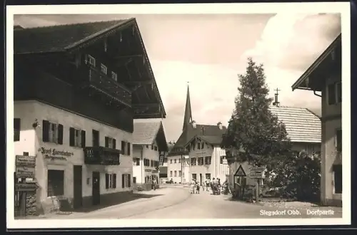 AK Siegsdorf /Obb., Ortspartie, Blick zur Kirche