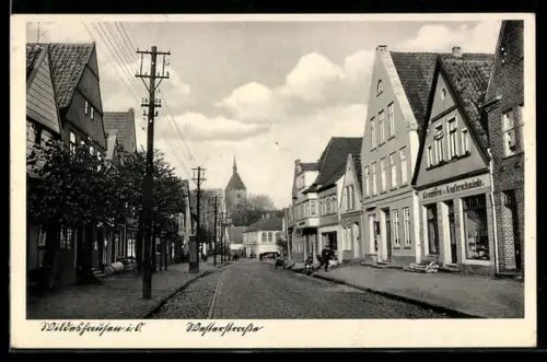AK Wildeshausen i. O., Westerstrasse mit Klempnerei / Kupferschmiede, Kirche