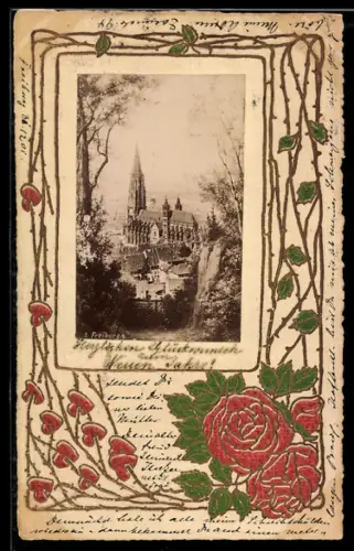 AK Freiburg i. B., Das Münster vom Berg aus, geprägtes Passepartout mit Rosenranken und Herzen