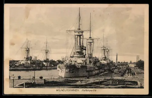 AK Wilhelmshaven, Hafenpartie mit Kriegsschiffen der Kaiserlichen Marine