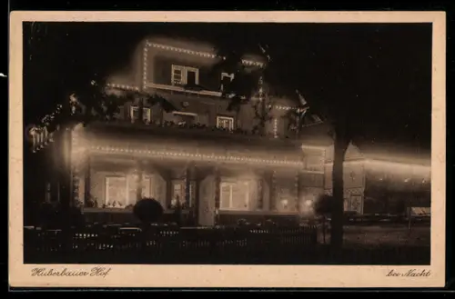 AK Herold i. Erzgeb., Fremdenheim Huberbauer Hof M. Ullrich & Sohn bei Nacht