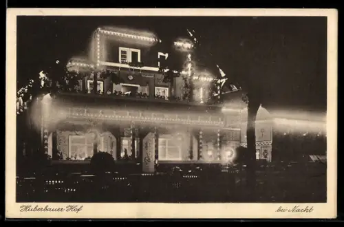 AK Herold i. Erzgeb., Hotel Huberbauer-Hof bei Nacht und Beleuchtung