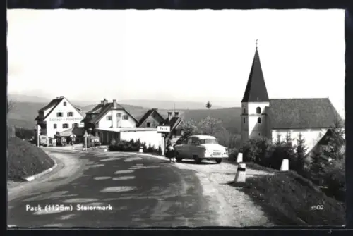 AK Pack /Steiermark, Strassenpartie mit Kirche