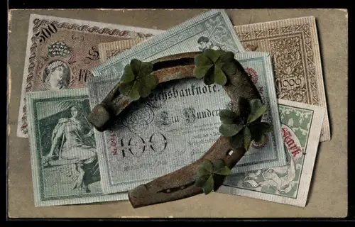 AK Hufeisen und Kleeblätter liegen auf Reichsbanknoten
