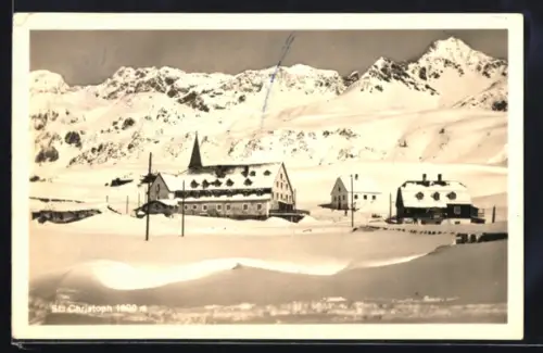 AK St. Christoph, Winterpanorama mit Kirche und Häusern