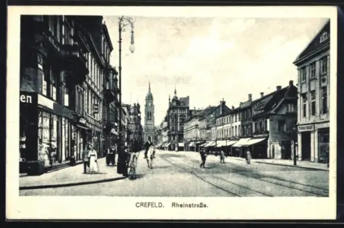AK Crefeld, Rheinstrasse, Strassenszene mit Geschäften und Passanten