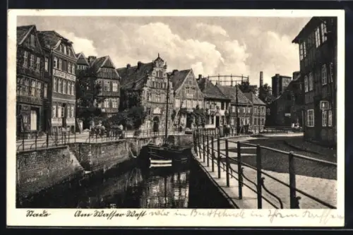 AK Stade, Am Wasser West, Strassenpartie mit Geschäftshäusern u. Wasserstrasse