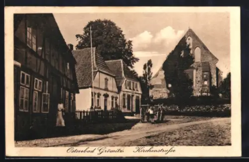 AK Grömitz, Kirchenstrasse mit Kirche, Kinder mit Karren