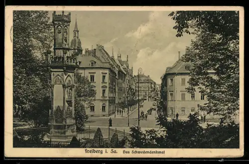 AK Freiberg i. Sa., Das Schwedendenkmal mit Strassenpartie