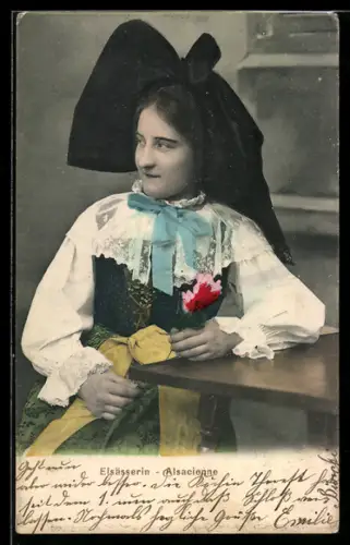 AK Frau am Tisch in elsass-lothringischer Tracht