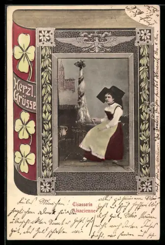 AK Sitzende Frau in elsass-lothringischer Tracht in einem Buch-Passepartout