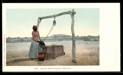 AK Papago Indian filling the Olla