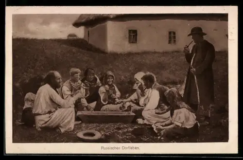 AK Russische Familie in Tracht beim gemütlichen Beisammensein