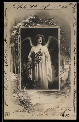 AK Weihnachtsengel neben einer Tanne, verschneiter Ort im Passepartout