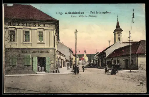 AK Ung. Weisskirchen, Blick in die Kaiser Wilhelm Strasse, Geschäft von Milan Jovanovits