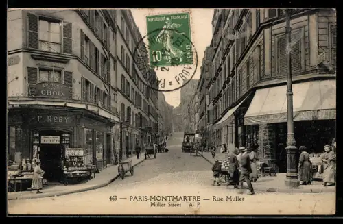 AK Paris, Montmartre, Rue Muller avec commerces et passants animés
