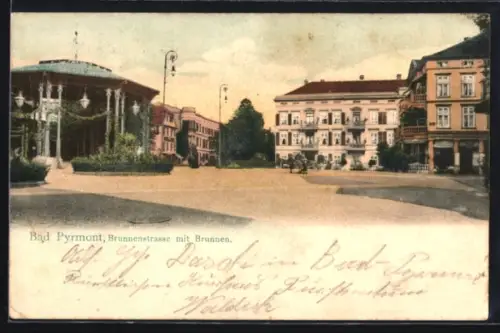 AK Bad Pyrmont, Brunnenstrasse mit Brunnen