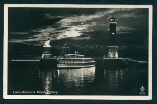 AK Lindau /Bodensee, Hafen mit Leuchtturm bei Nacht