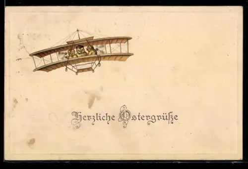 AK Küken in Flug mit Doppeldecker-Flugzeug, Ostergrüsse